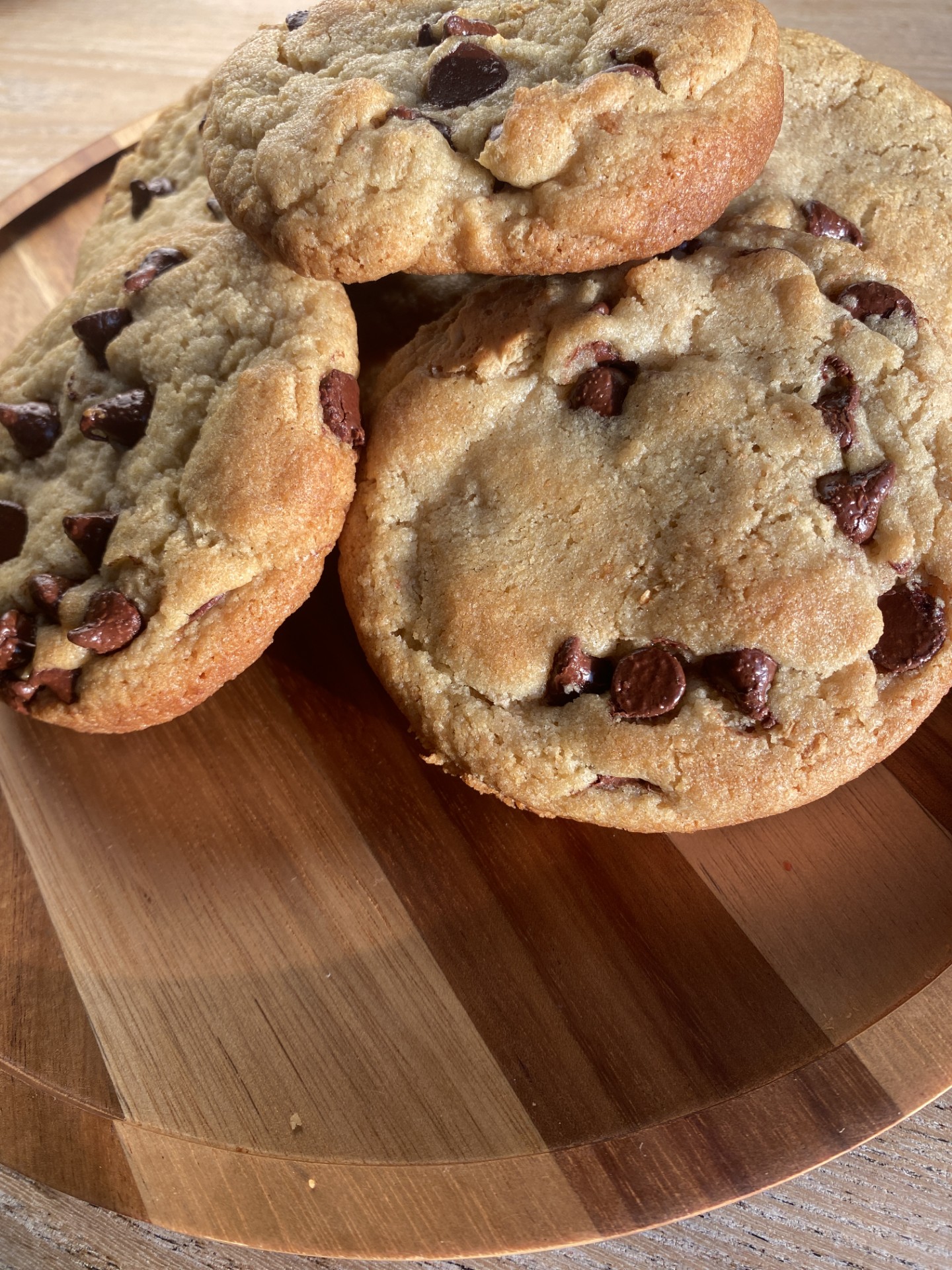 Half-pound New York style chocolate chunk cookie pulled apart with melted chocolate stretching between the halves